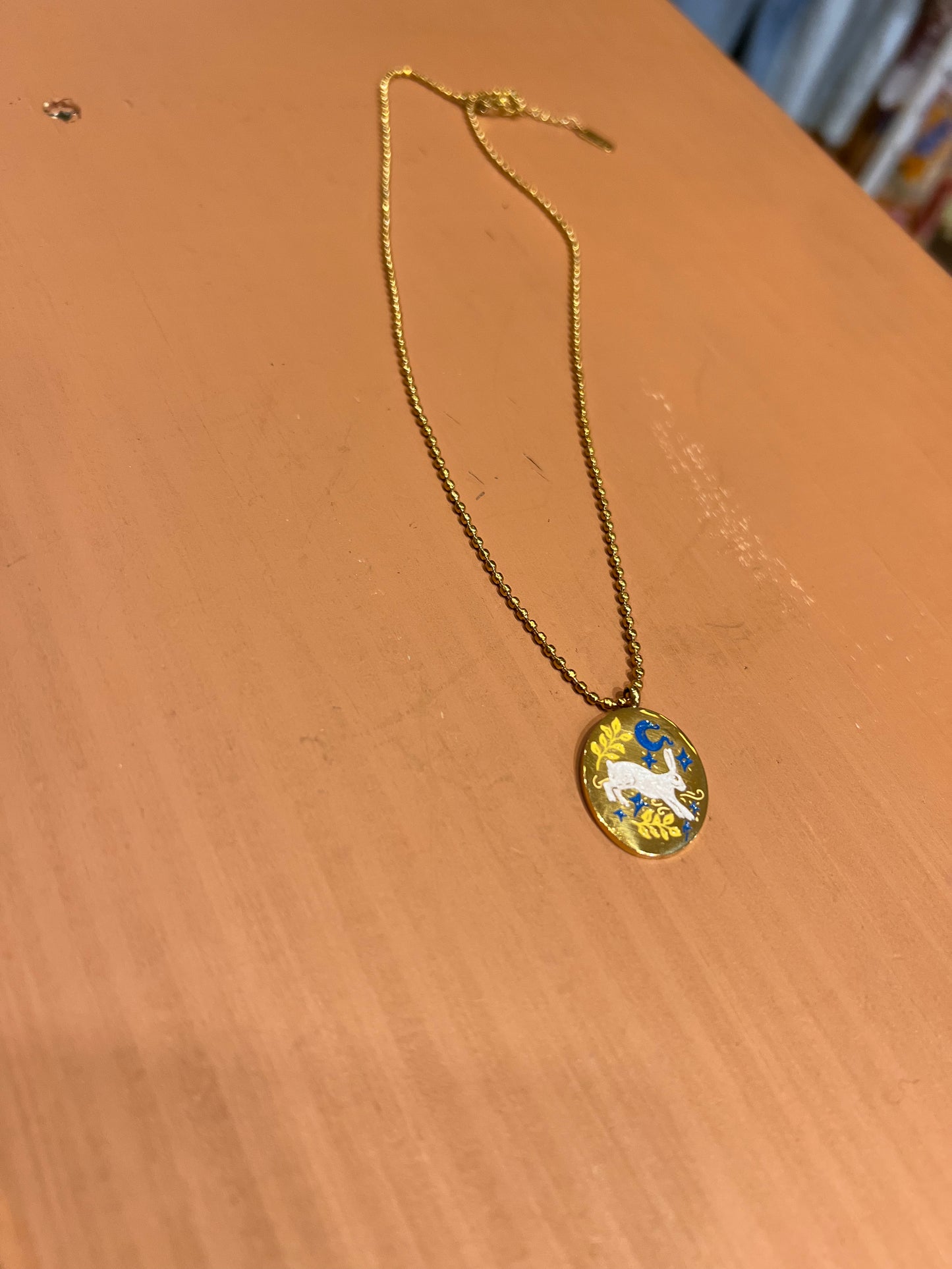 Gold tone WP bunny necklace