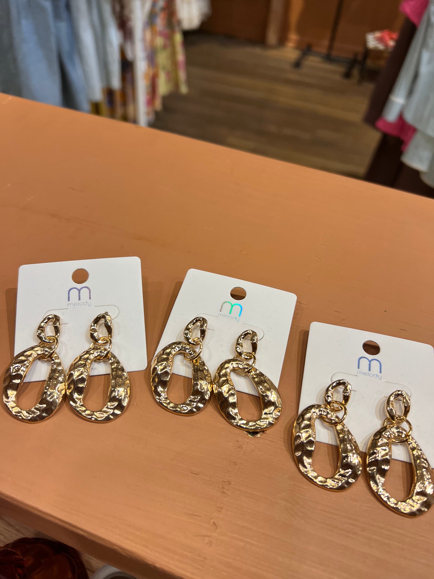 Gold tone hammered dangle earrings