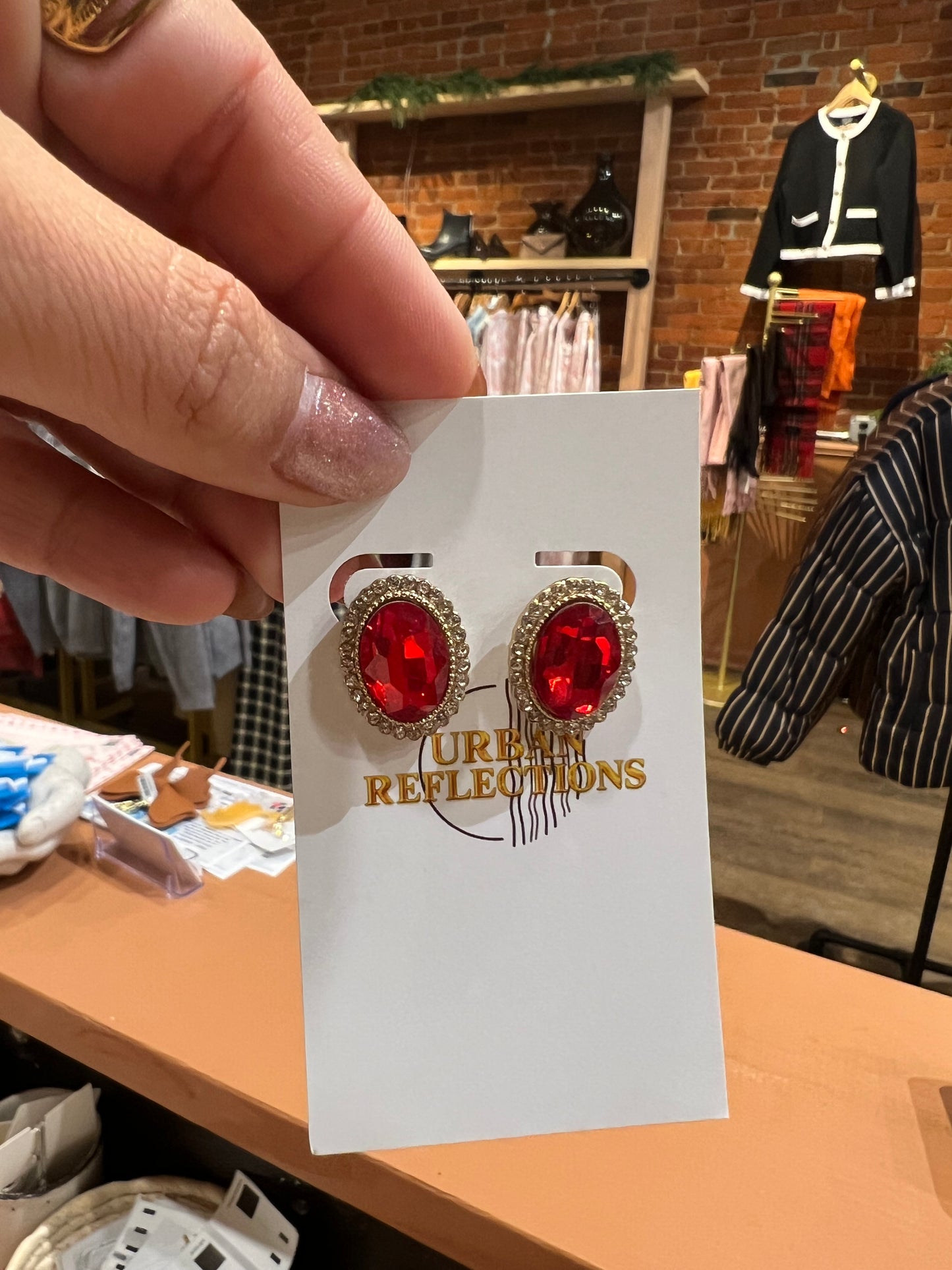 Red jeweled oval earrings